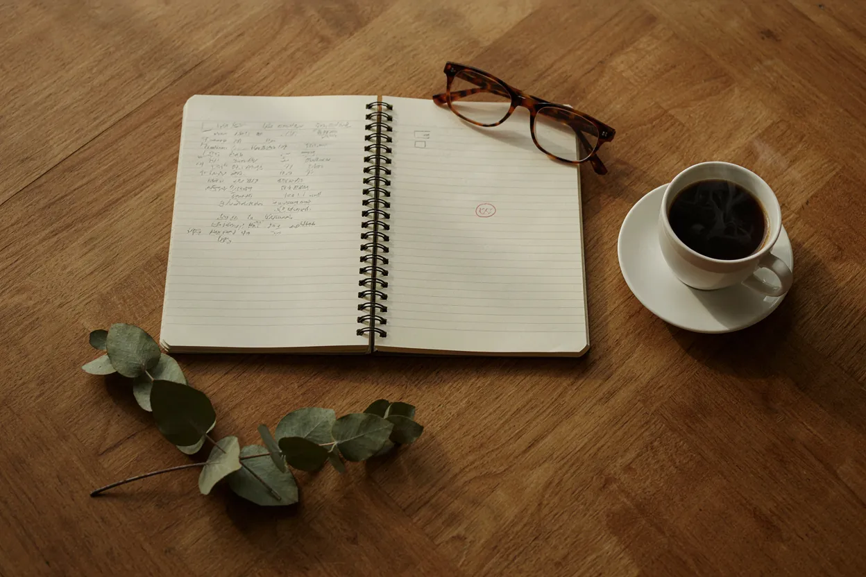 Calculating your retirement number Notebook with calculations and a circled target retirement number